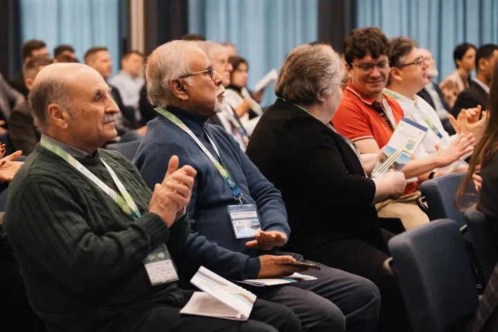 Delegates following a session at a KomPlasTech conference